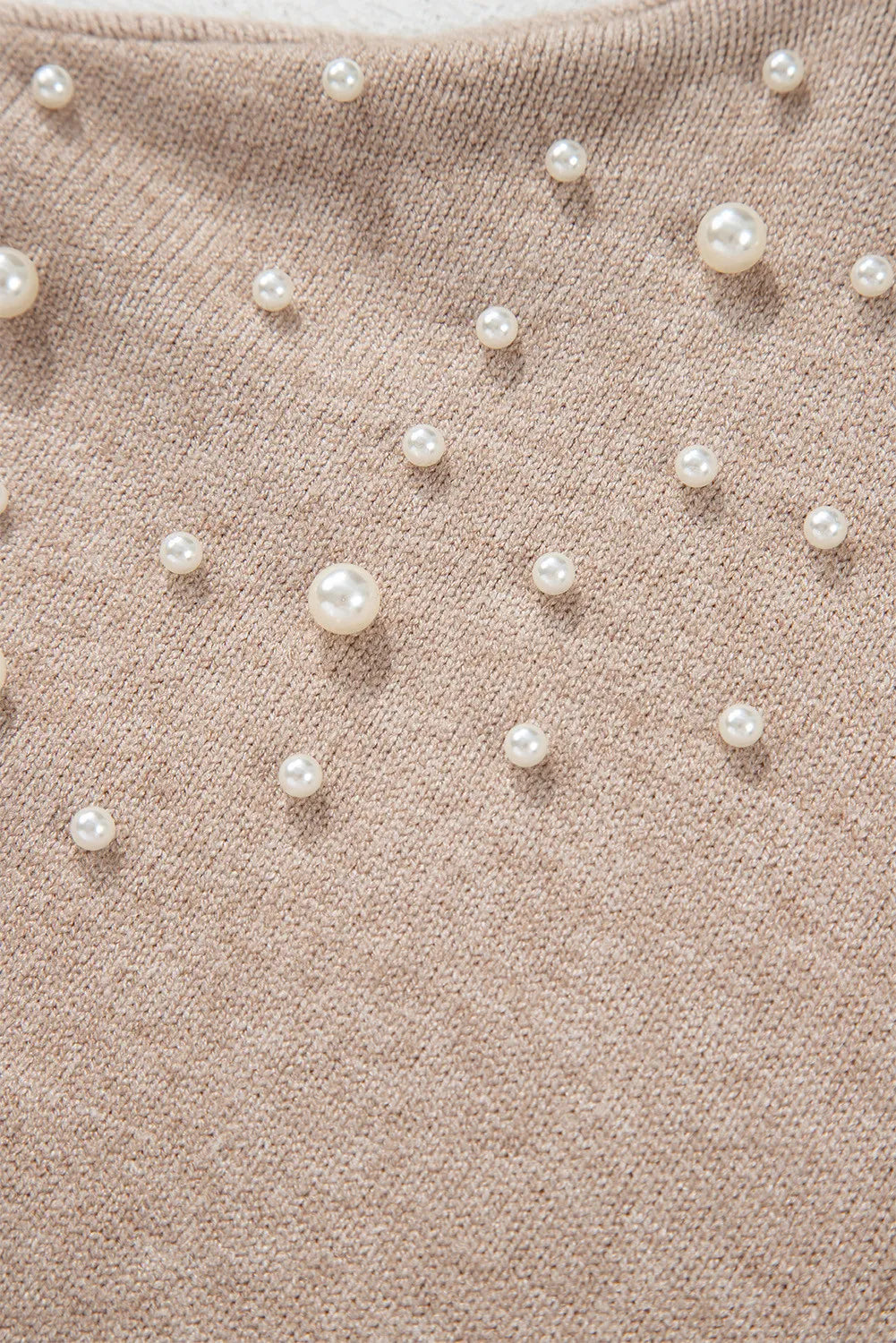 Suéter de manga larga con cuello redondo y detalle de perlas en talla grande