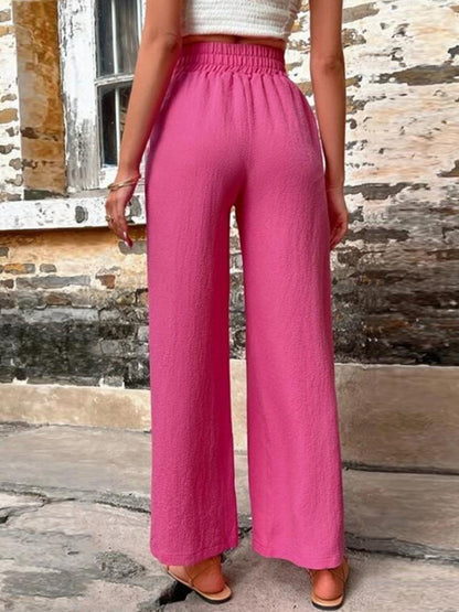 Pantalones anchos de cintura alta con bolsillos y cintura anudada