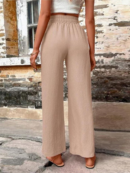Pantalones anchos de cintura alta con bolsillos y cintura anudada