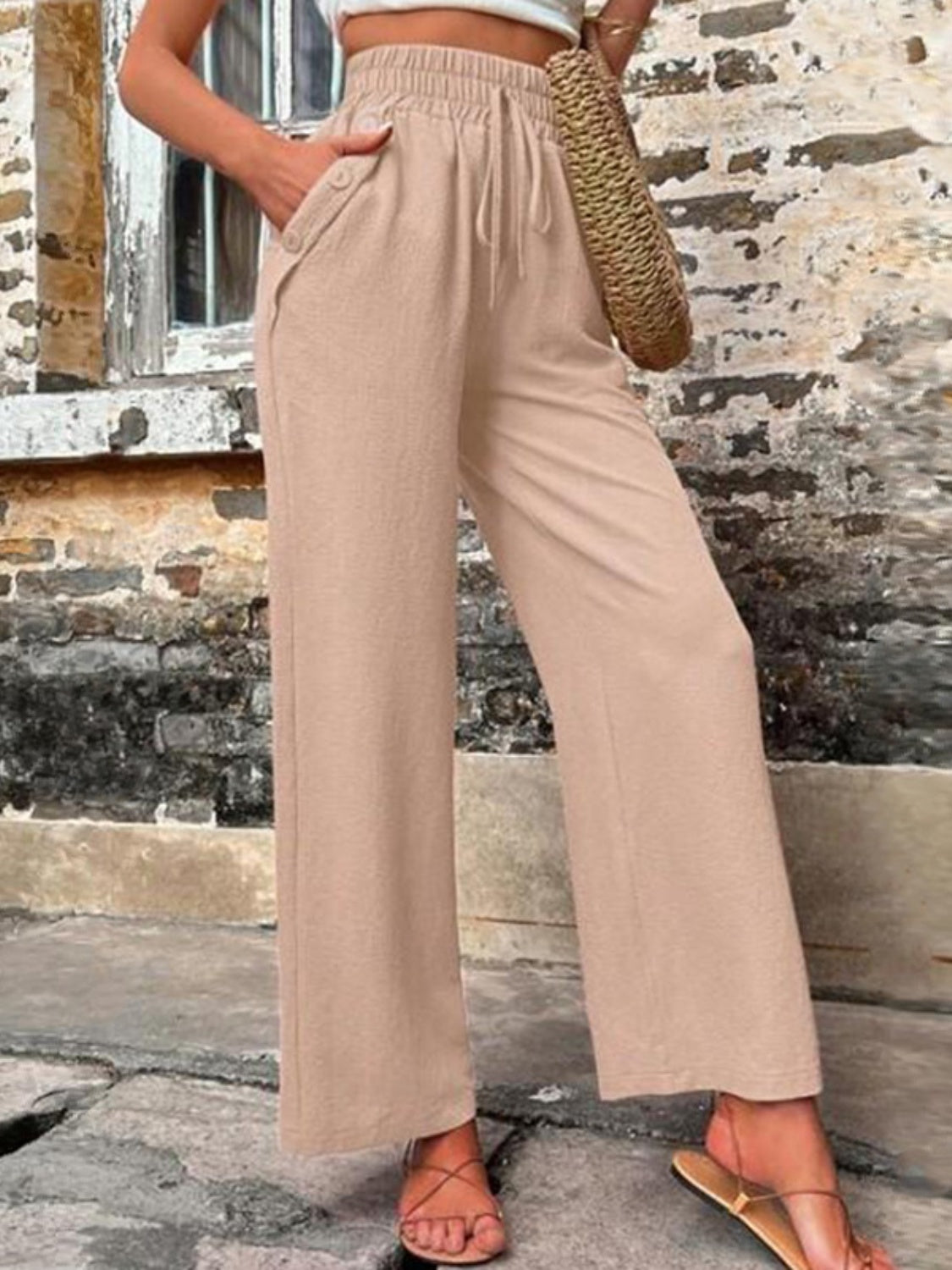 Pantalones anchos de cintura alta con bolsillos y cintura anudada